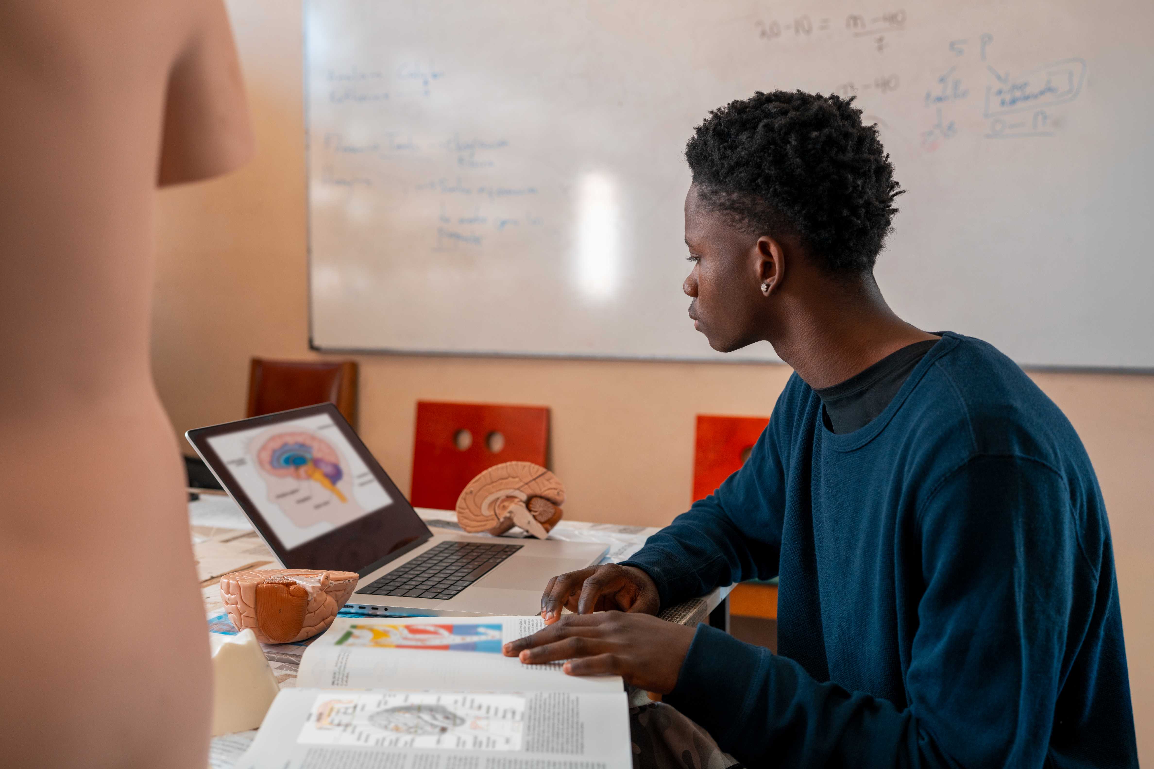 Student revising on a laptop