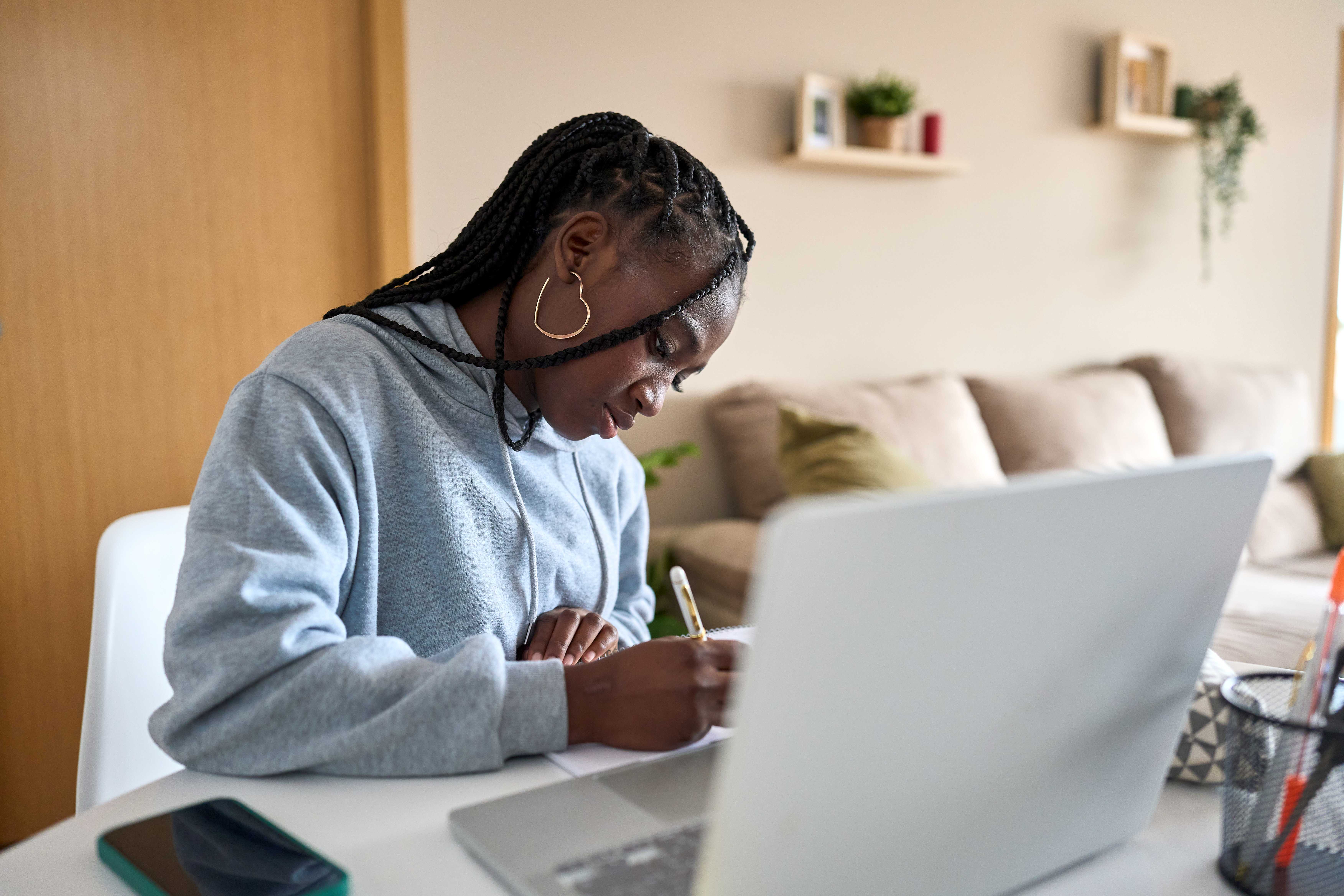 Student revising with a laptop